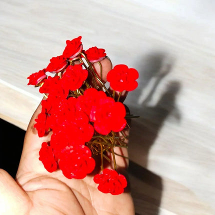 Close-up of TDF TALES red rose hairpin – perfect hair accessory for brides